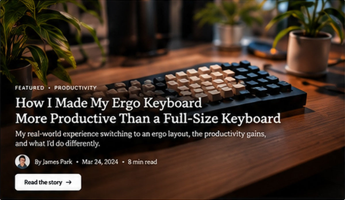 Ergo keyboard with beige and dark keycaps on a wooden desk